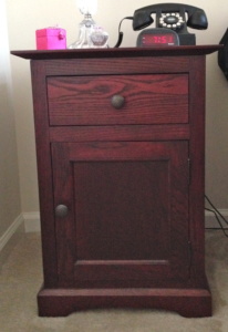 Handmade wooden nightstand with a mahogany stain